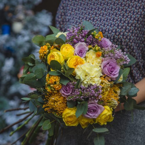 woman-holding-bouquet-fall-autumn-color-flowers-hand